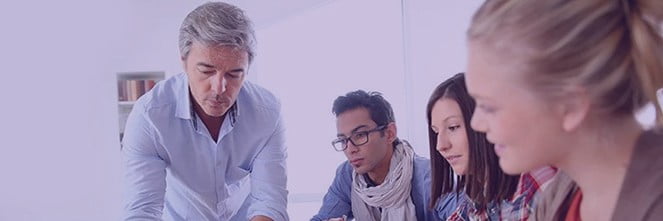 UG Images 318x106-37 man going over material with colleagues