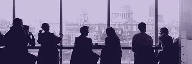 UG Images 318x106-5 co-workers sitting in front of window